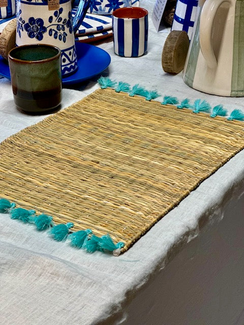Set de table avec pompons bleu turquoise
